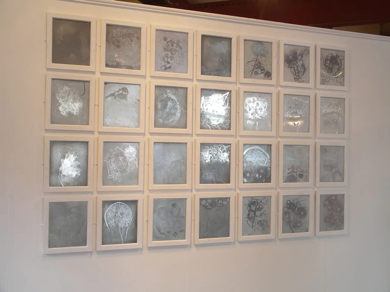 Mirror <strong>Brainscapes</strong>. Installation of 28 zinc etching plates, Susan Aldworth, 2002. Photograph at Whitechapel Gallery, London by Brian Campbell.