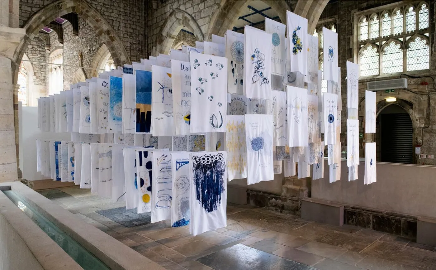 <strong>1001 Nights</strong>, installation of embroidered pillowcases, Susan Aldworth, 2017. Photograph by Paul Hughes.
