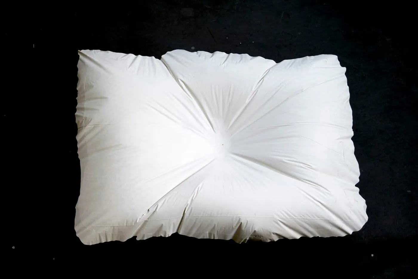 <strong>Evidence of Sleep III</strong>, (detail) installtion of 5 plaster pillows, Susan Aldworth, 2017. Photograph by Paul Hughes.