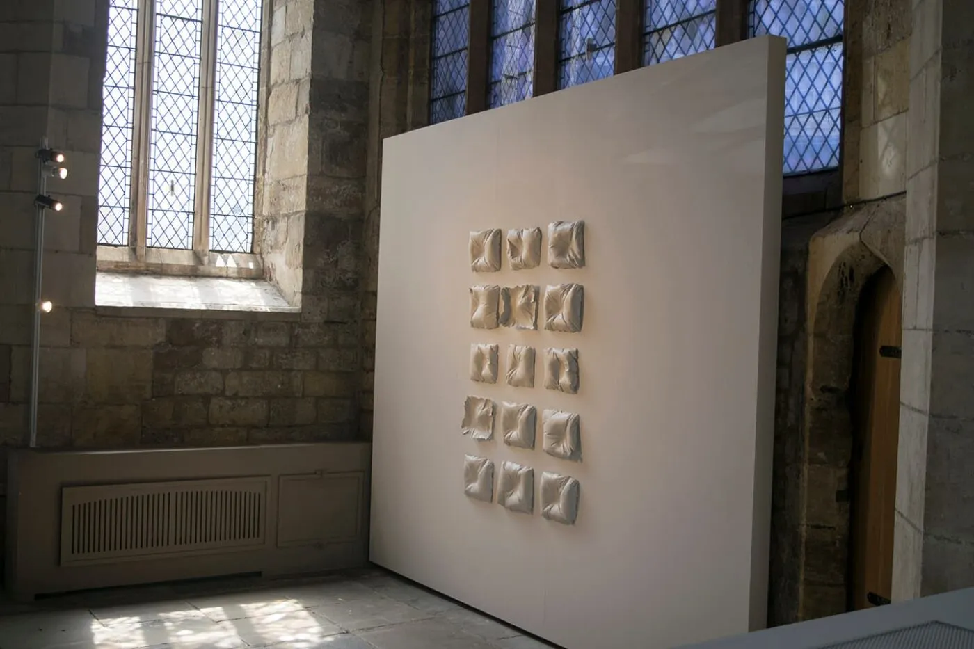 <strong>Evidence of Sleep 1</strong>, installation of porcelain pillows, Susan Aldworth, 2017. Photograph by Paul Hughes.