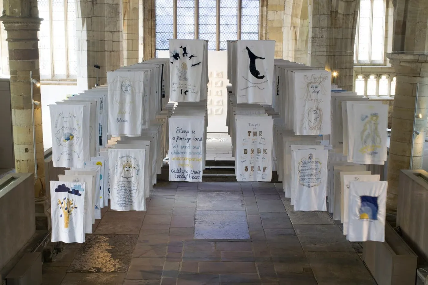 <strong>1001 Nights</strong>, installation of embroidered pillowcases, Susan Aldworth, 2017. Photograph by Paul Hughes.