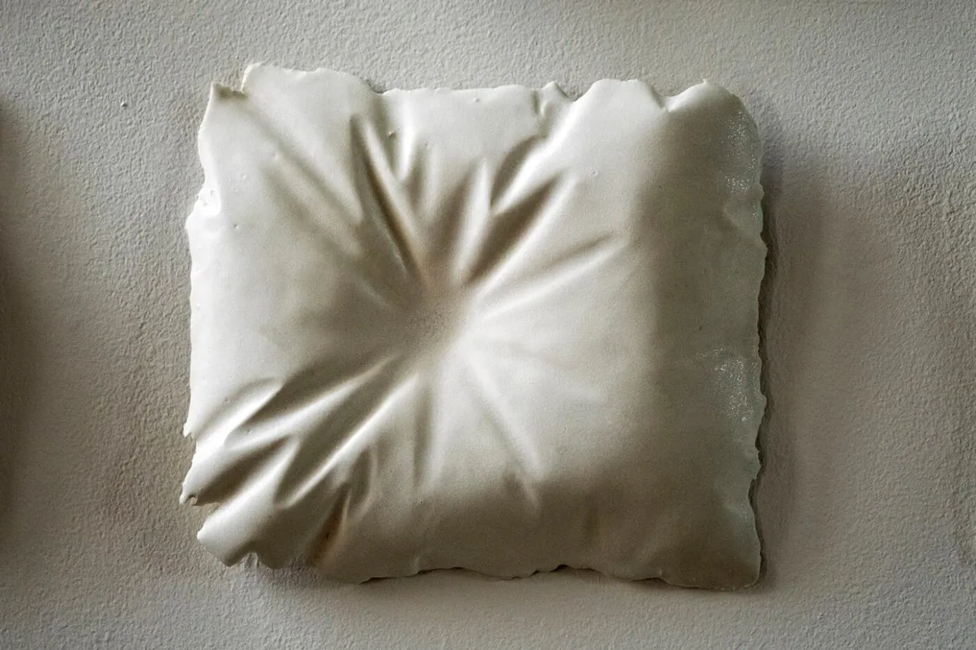<strong>Evidence of Sleep I</strong>, (detail) installation of 15 porcelain pillows, Susan Aldworth, 2017. Photograph by Paul Hughes.